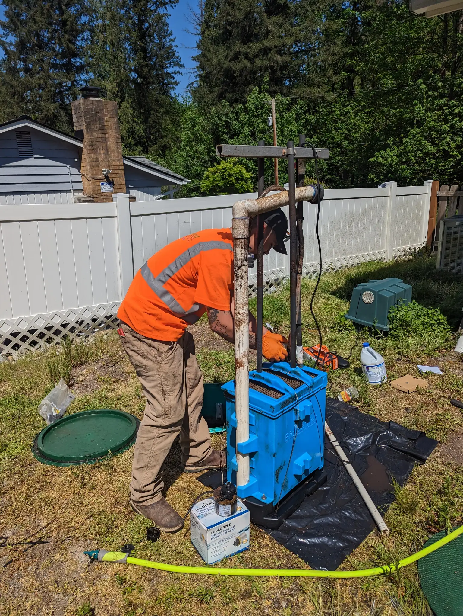 Technician servicing a septic tank system
