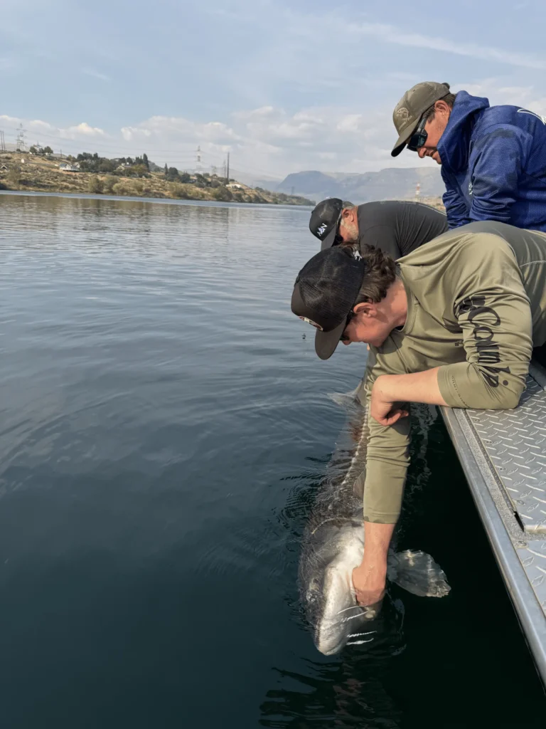 A&N Plumbing summer trip team on the Columbia River Basin during the morning launch