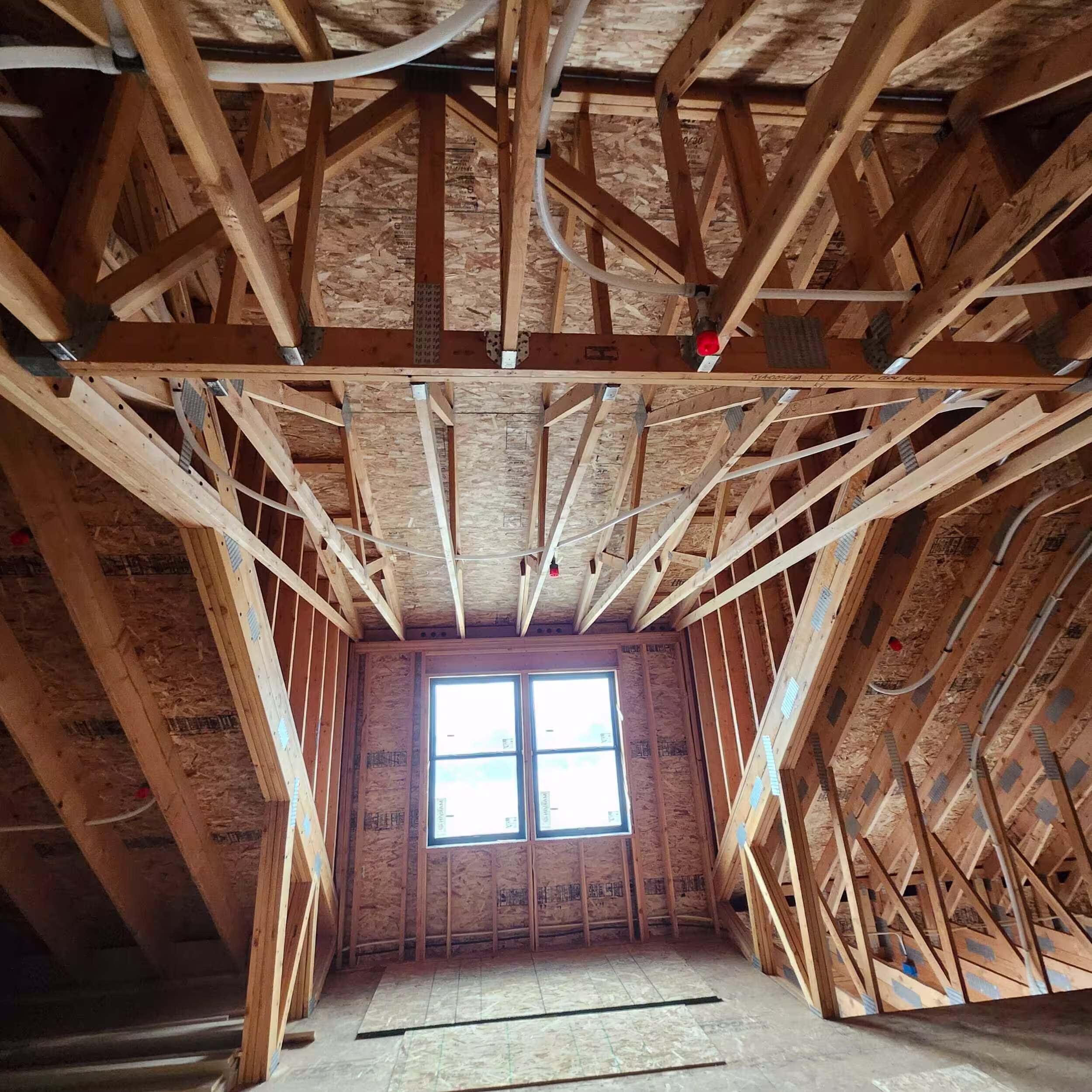 Home fire suppression system integrated into residential plumbing layout during construction