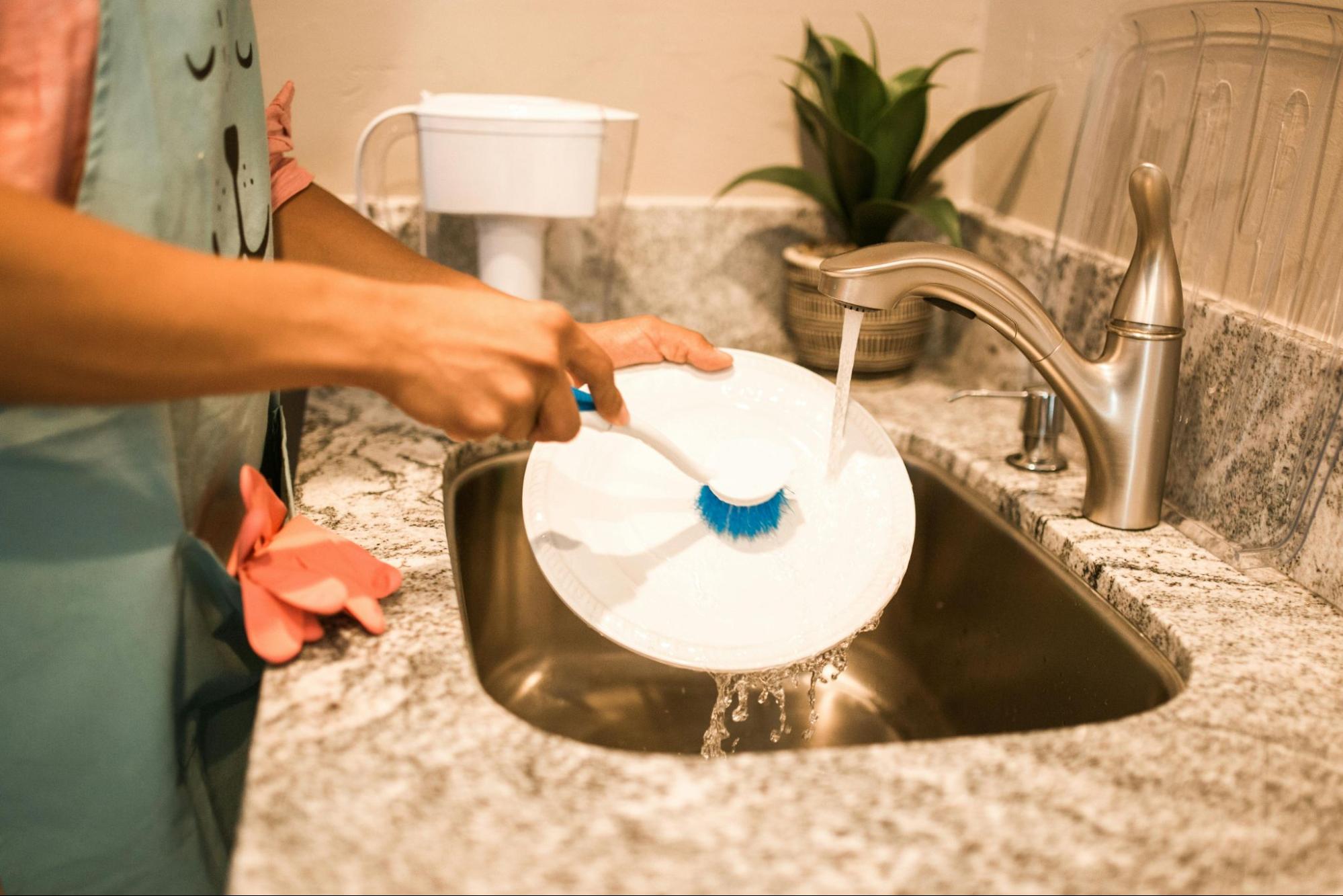 Clean tap water flowing at a Wenatchee, WA kitchen sink served by a professionally installed water filtration system from A&N Plumbing.