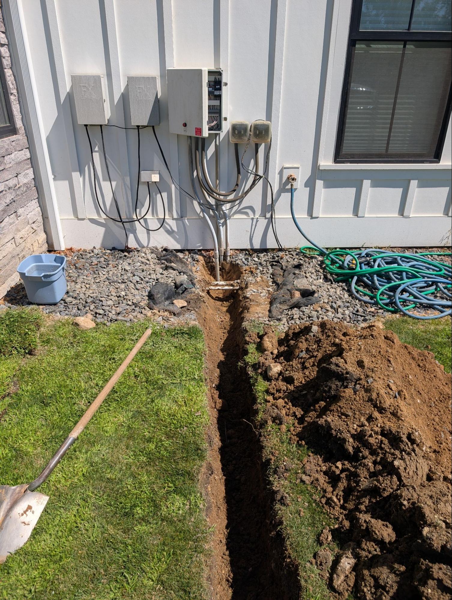 A&N Plumbing trenching a line for septic system installation at a Wenatchee, WA home