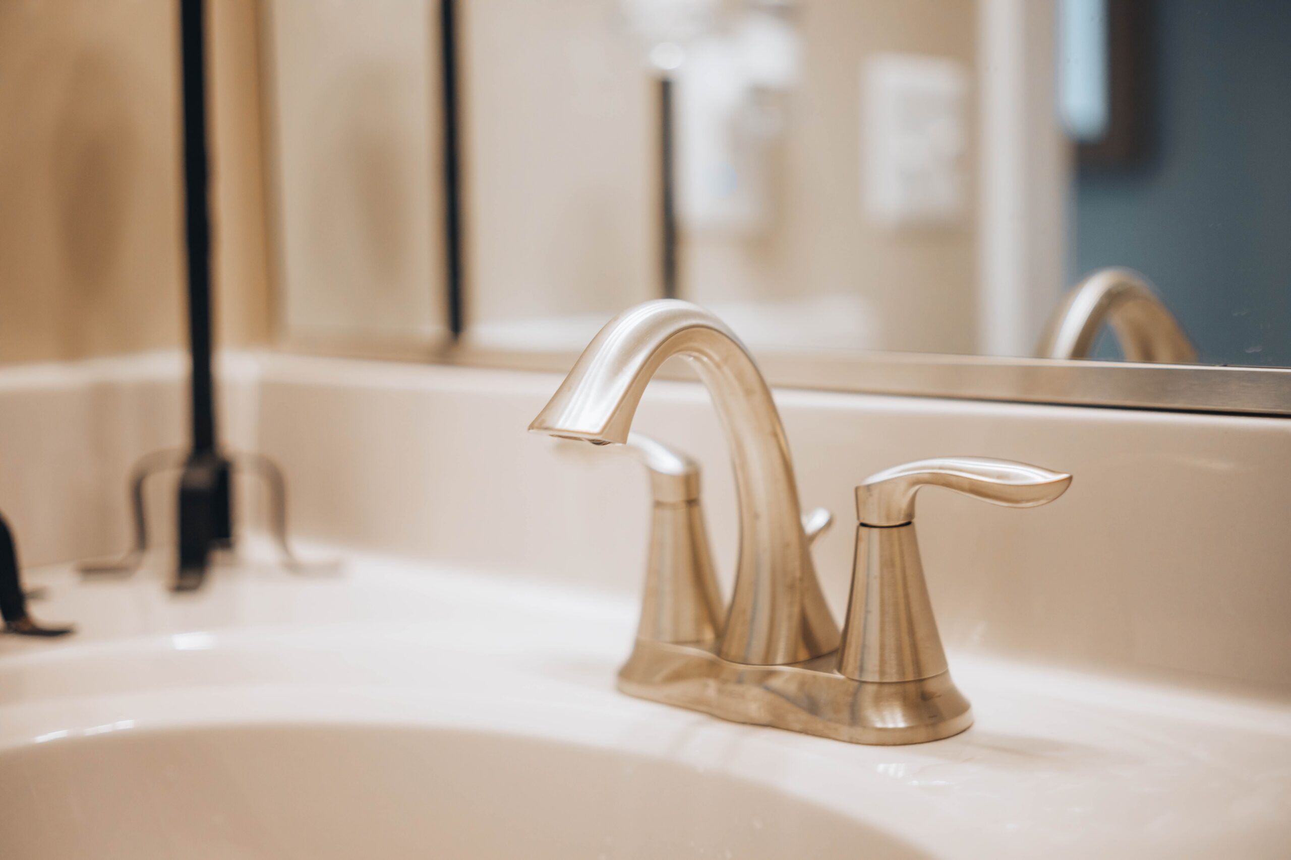 A brushed nickel bathroom faucet, one of the fixtures covered by plumbing repair in Gilbert, AZ.