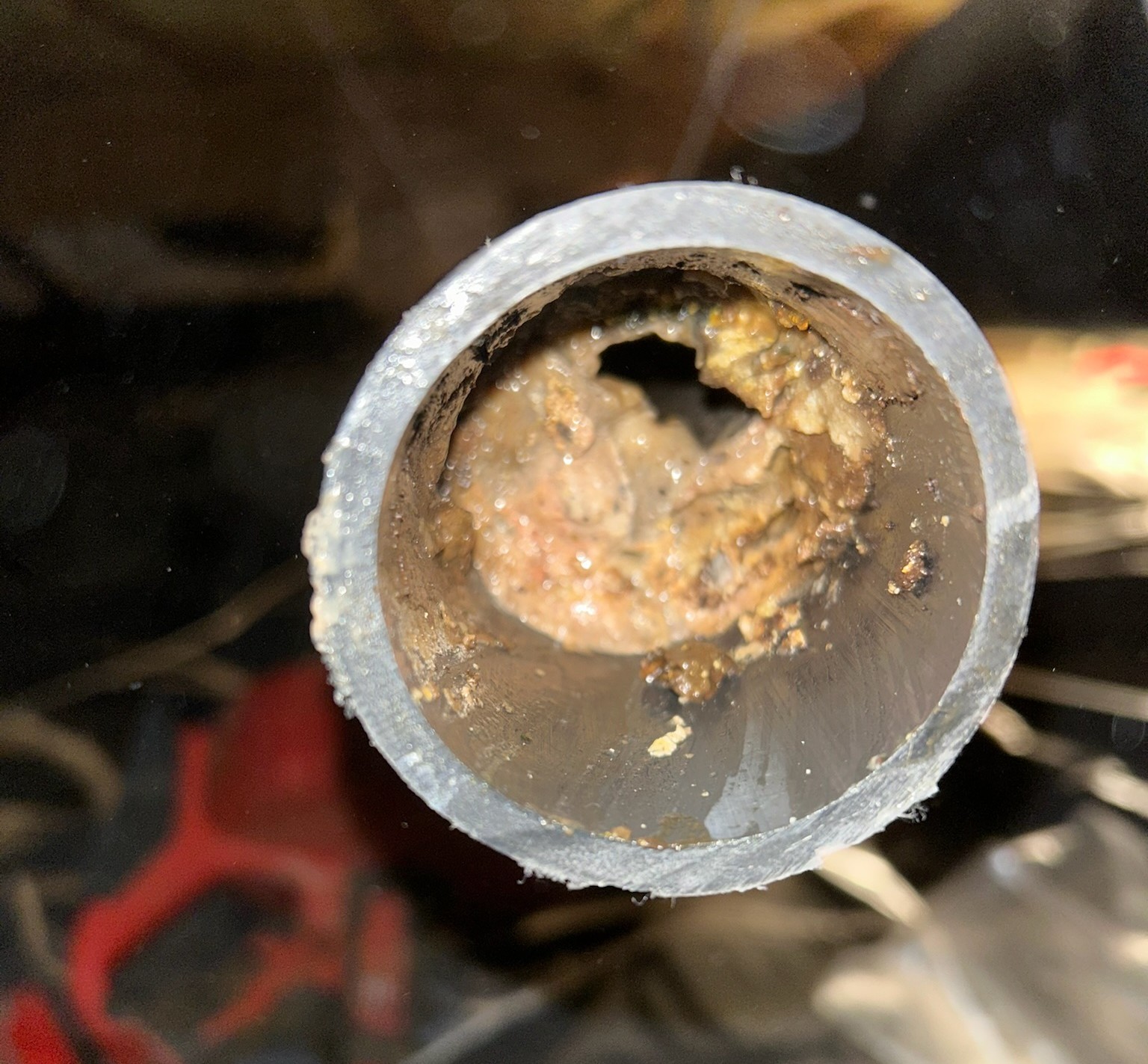 A corroded galvanized pipe cross-section showing buildup that caused a water line repair.